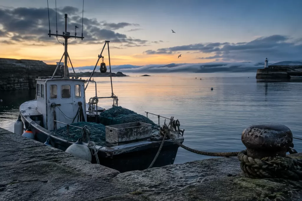Empty small fishing boat in a fictional bluefin tuna commercial fishery 2026 harbour editorial image