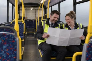 Two laughing planners for bus franchising funding