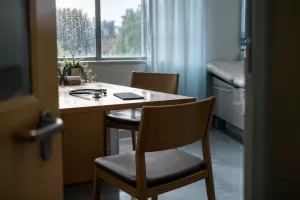 Empty consultation room for fictional MHRA AI healthcare public views 2026 editorial photograph