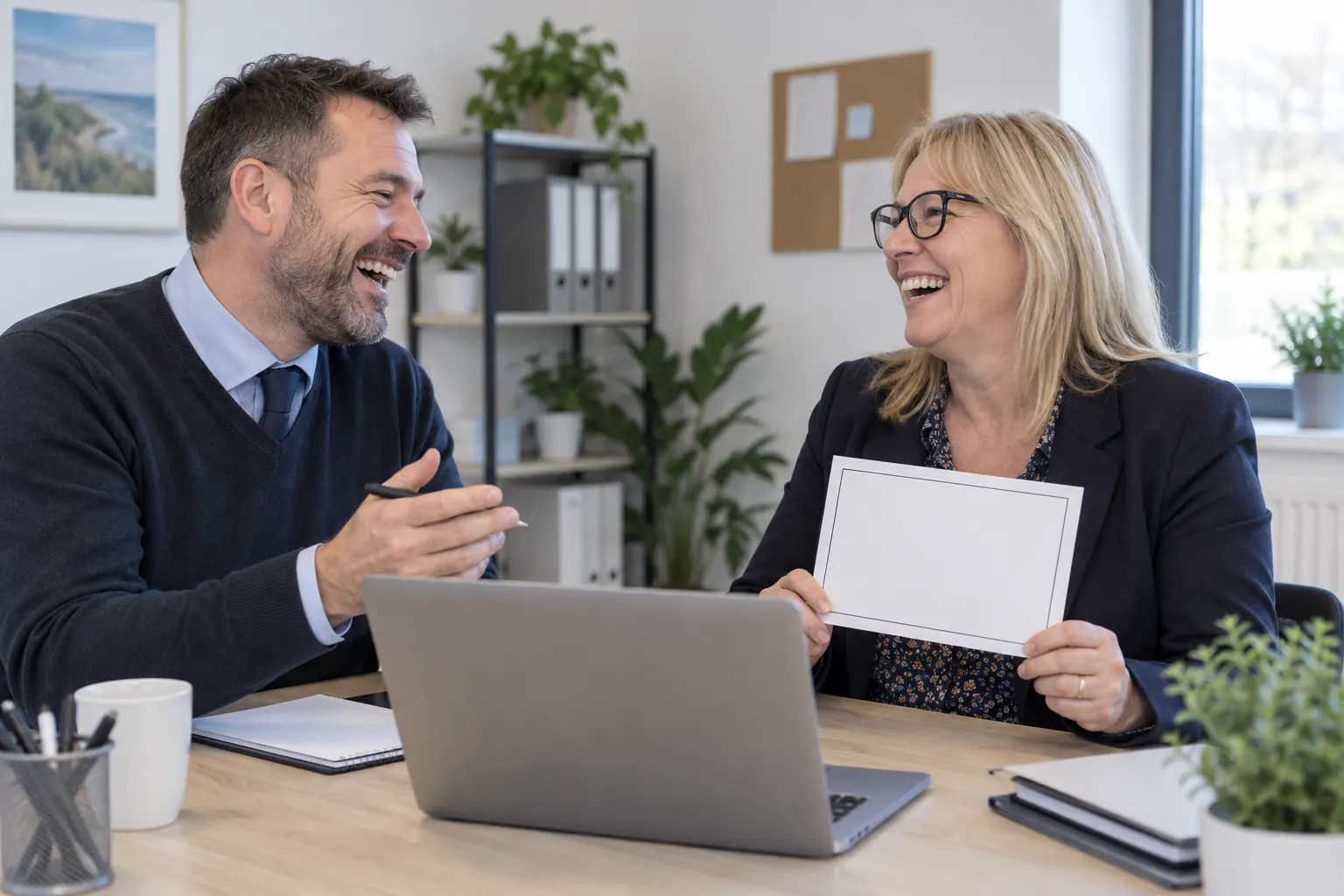 Two laughing employment advisers for welfare reforms employment support